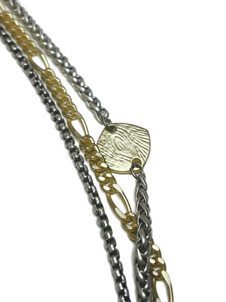Joce - necklace of mixed metal chains with etched gold accent
